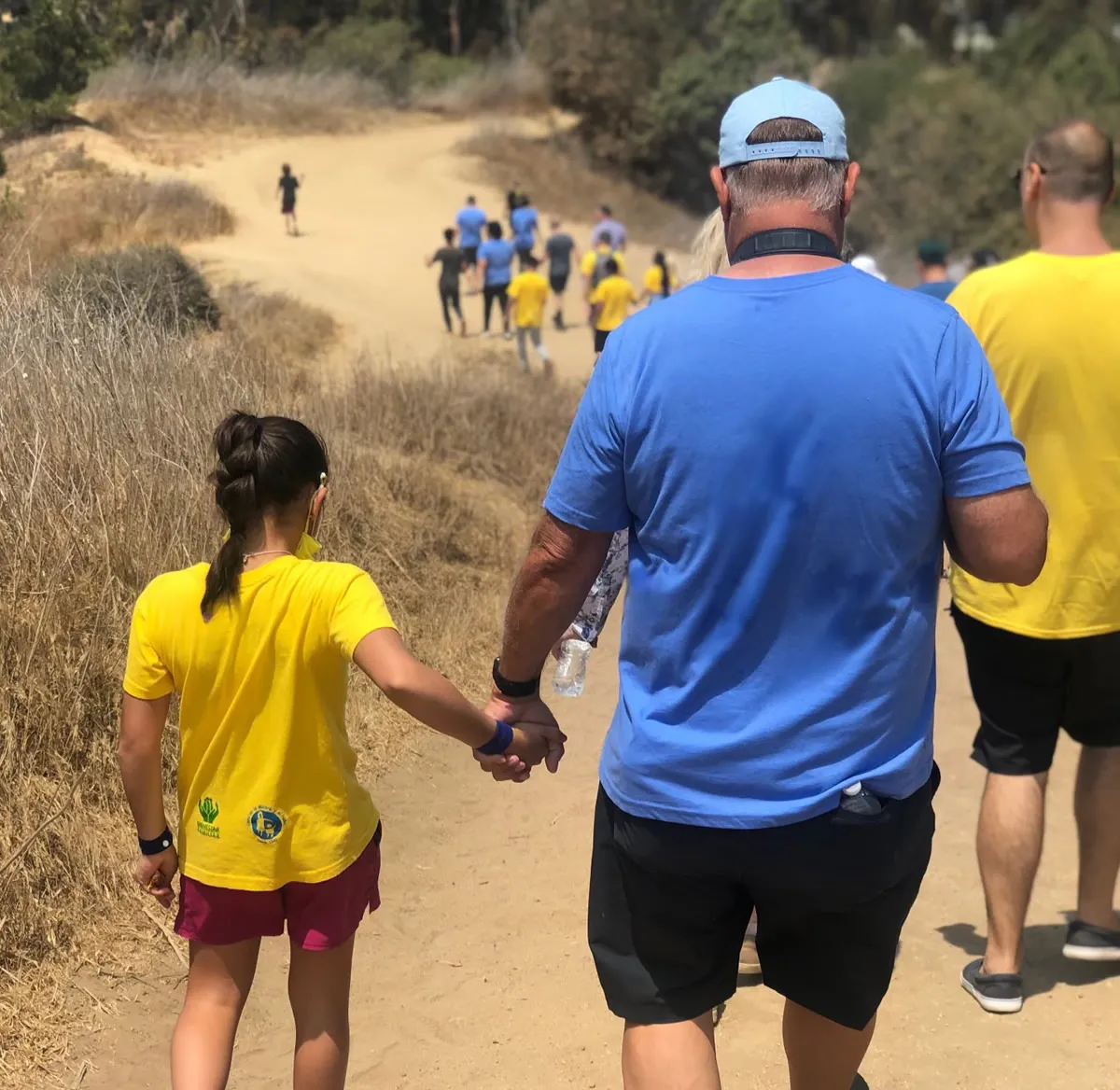 A Summer Miracles kid holds her host parent’s hand for support while on a hike in SoCal. Summer Miracles Kids Events - Los Angeles
